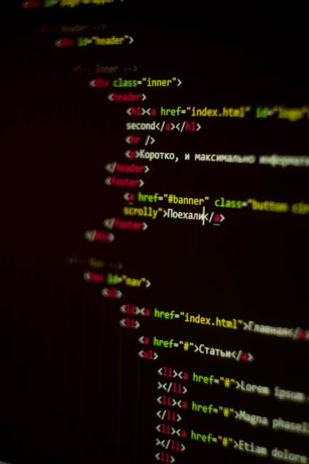 A detailed digital photograph of code displayed on a computer screen, showing colorful HTML and CSS syntax. The code includes tags such as <h1>, <div>, and <img>, with class attributes like 'real colo